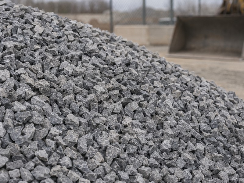 Stockpile of graded crushed stone aggregate at a materials yard